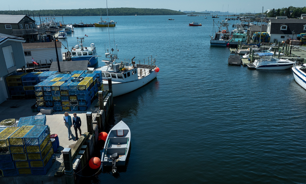 A wide shot of the wharf and harbourfront at Fisherman's Cove