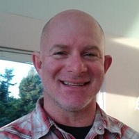 A headshot photo of Dr. Rylan Higgins