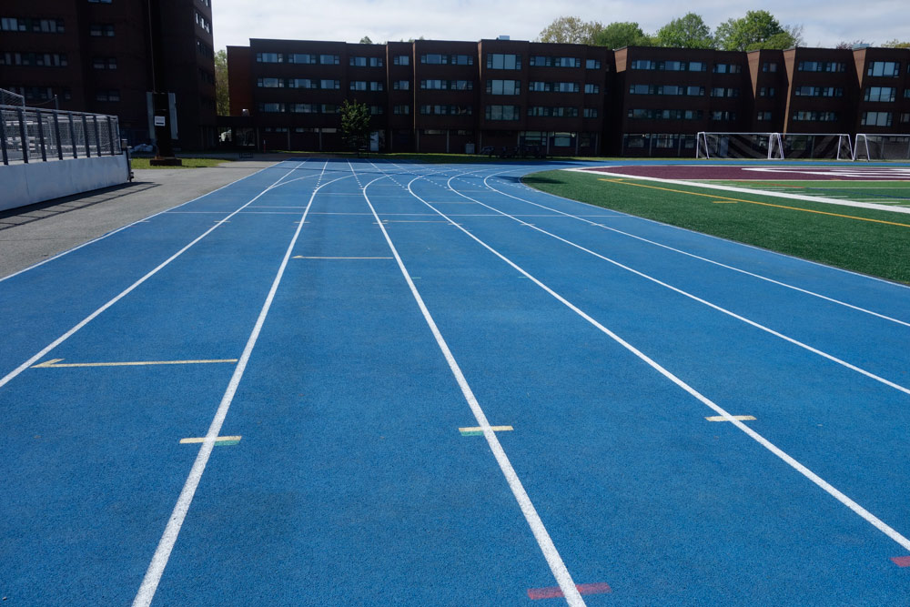 Huskies Stadium looking across blue running track surface