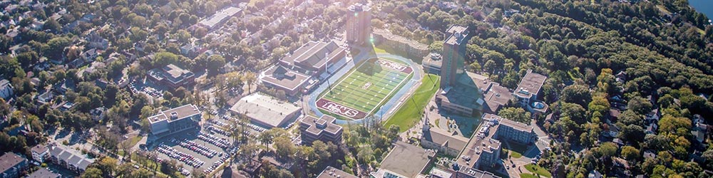 A aerial shot of campus with the sun shining.