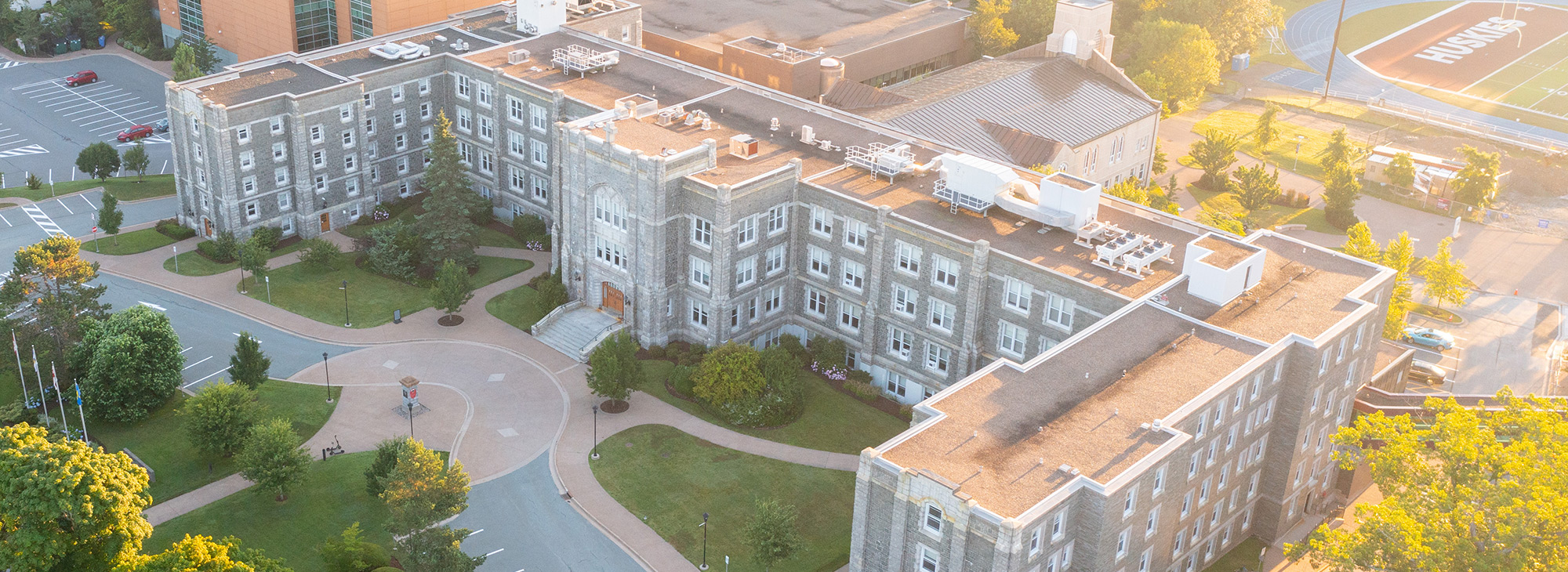 Aerial of the McNally Building with the evening sun streaming from behind.